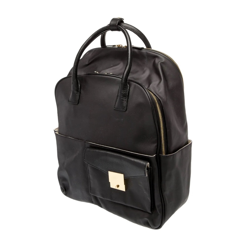 India Hicks Jet Pack Black leather backpack with gold accents
